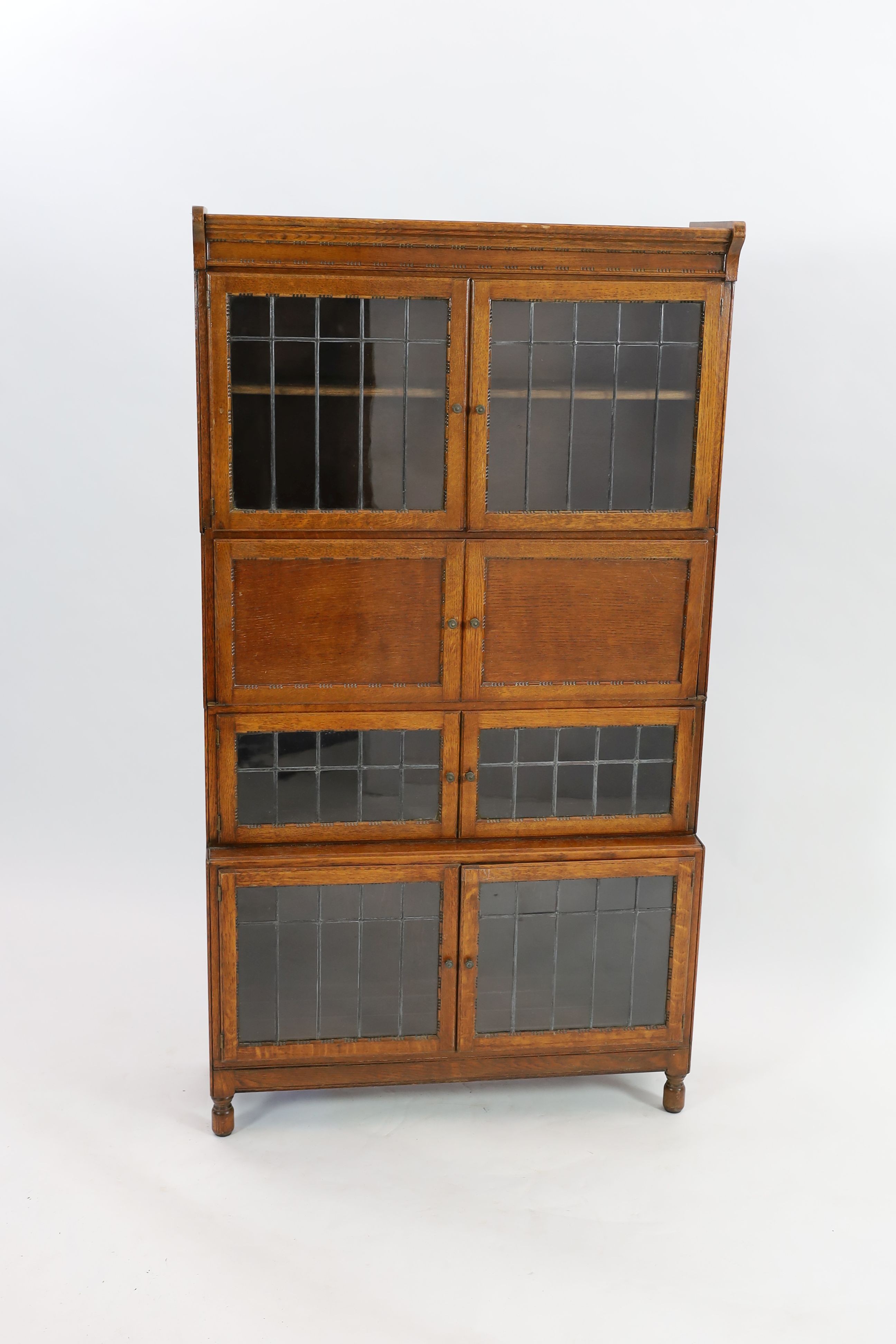 An early 20th century Globe Wernicke style four section bookcase, with leaded glazed doors, width 89cm depth 30cm height 162cm